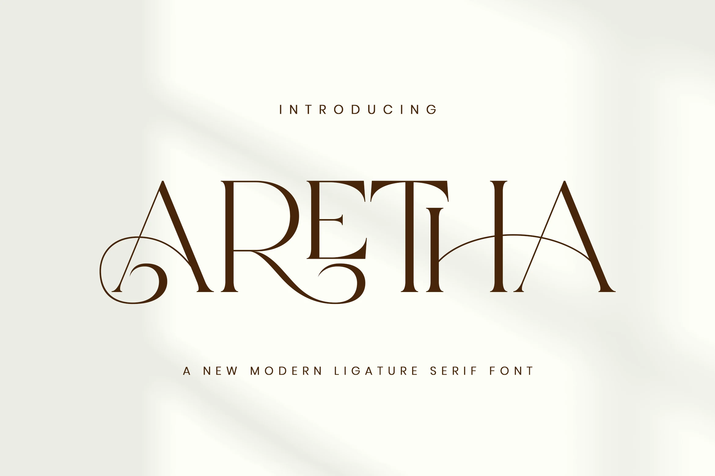 Aretha Font preview with brown high-contrast serif lettering and sweeping ligatures