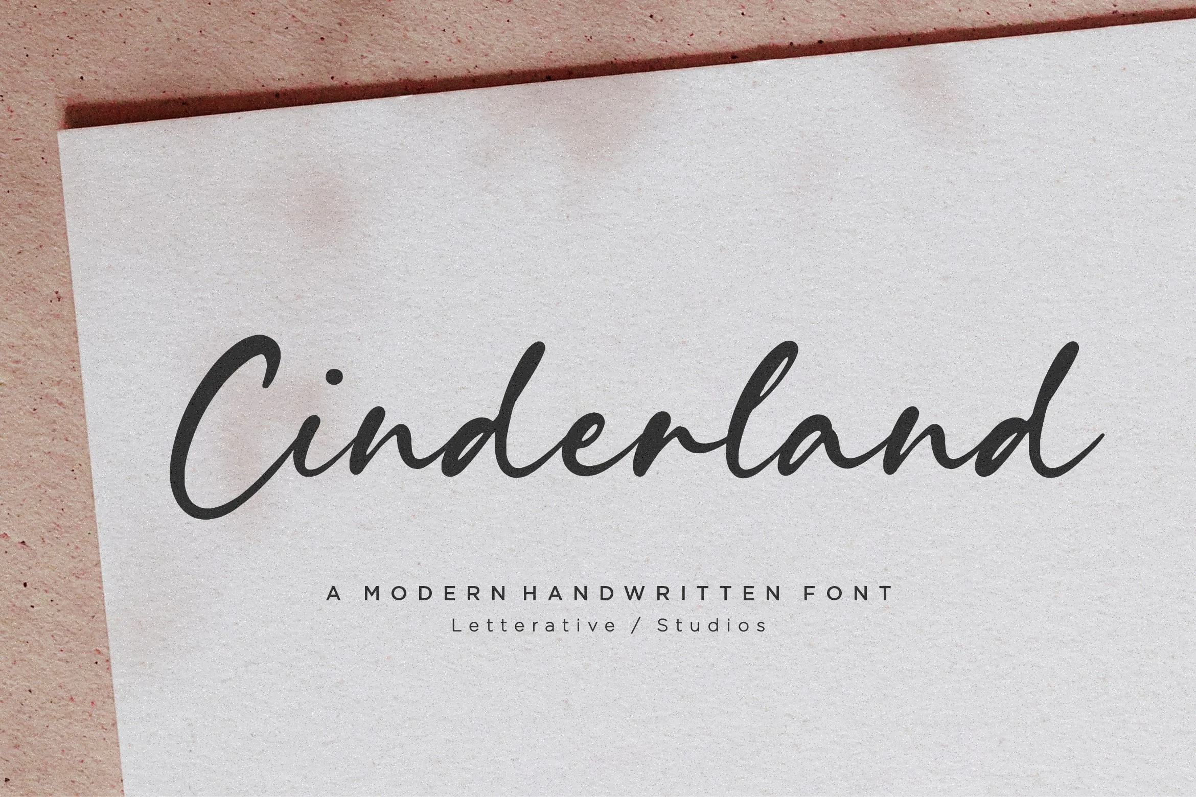 Cinderland Font preview with dark gray handwritten script, tapered strokes, and a sweeping capital C