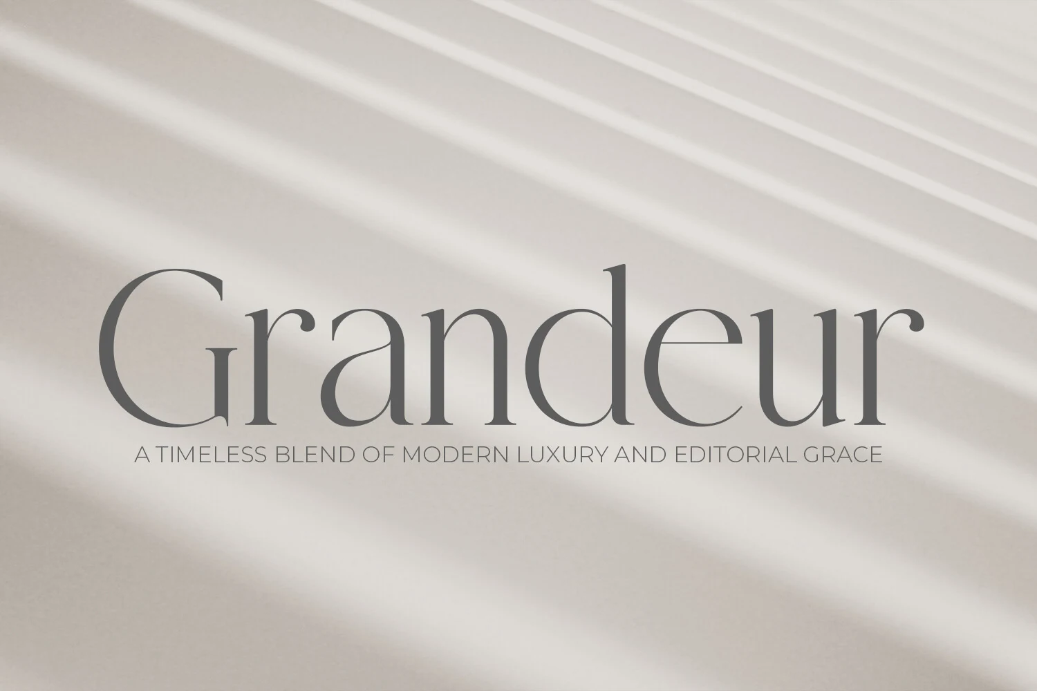 Grandeur – Elegant Classic Serif Font preview showing refined gray serif lettering with thin high-contrast strokes