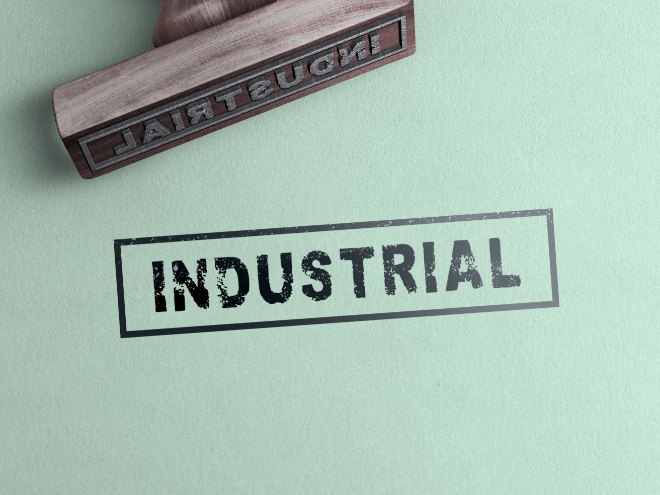 Industrial Font preview with rough black stamped lettering and distressed block shapes