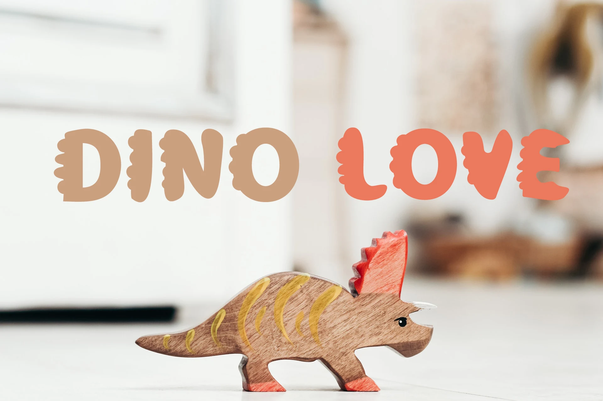Dino Love Font shown in bold, rounded lettering with playful scale-textured edges.