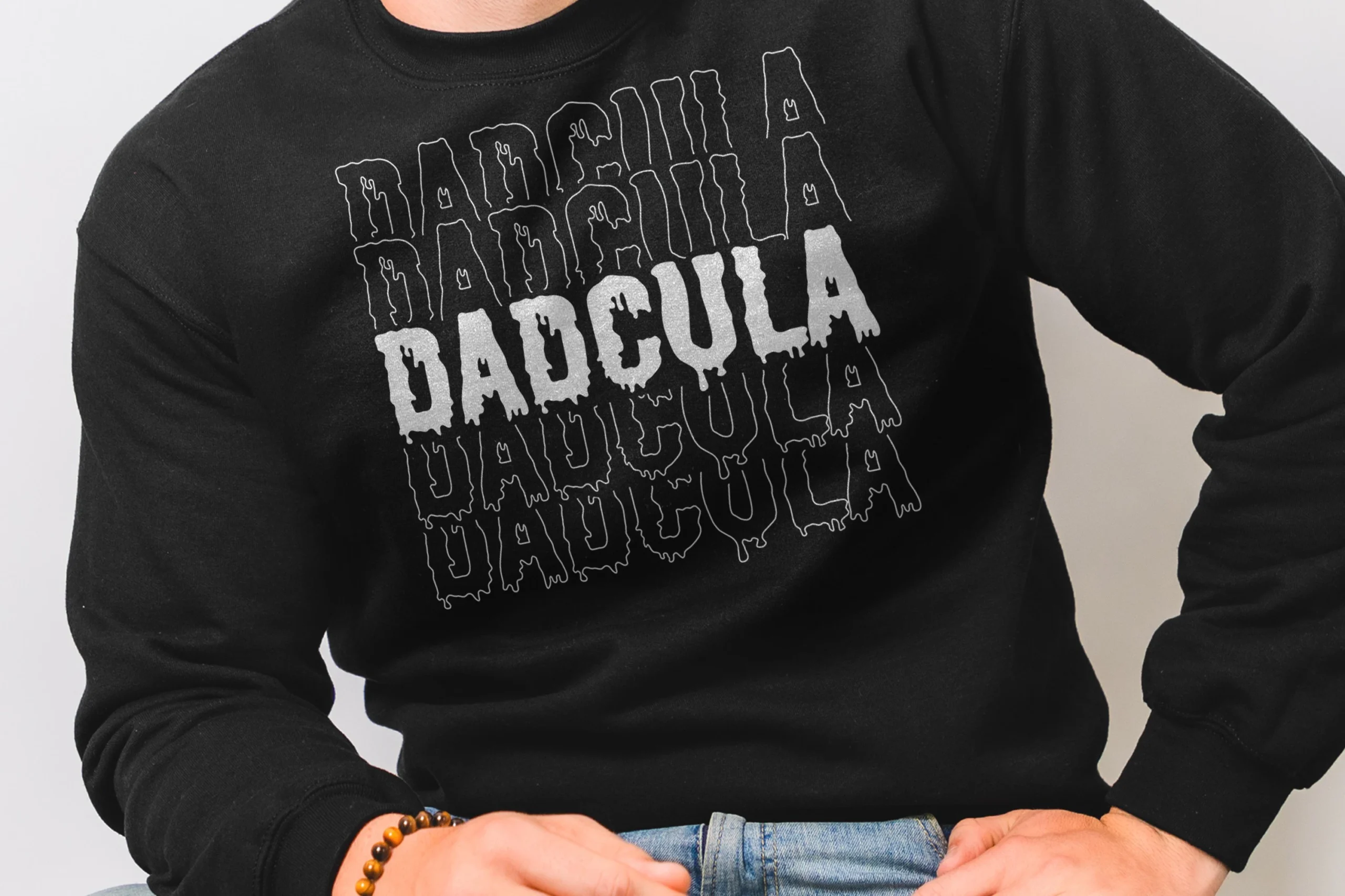 Dadcula SVG, Halloween Svg, Spooky Dad featuring five stacked rows of dripping Dadcula typography, with a solid central row and outlined surrounding rows.