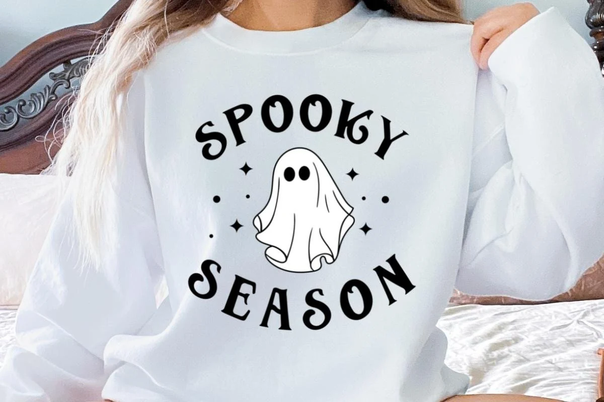 Spooky Season Cute Ghost Halloween SVG showing arched SPOOKY and curved SEASON lettering around a central line-art ghost with star and dot accents.